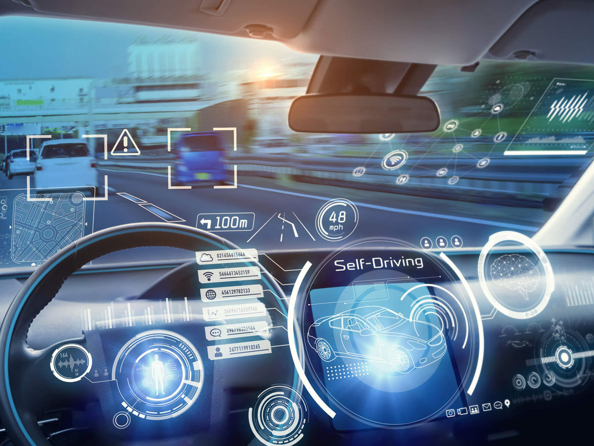 Cockpit of futuristic autonomous car displaying augmented reality overlays.