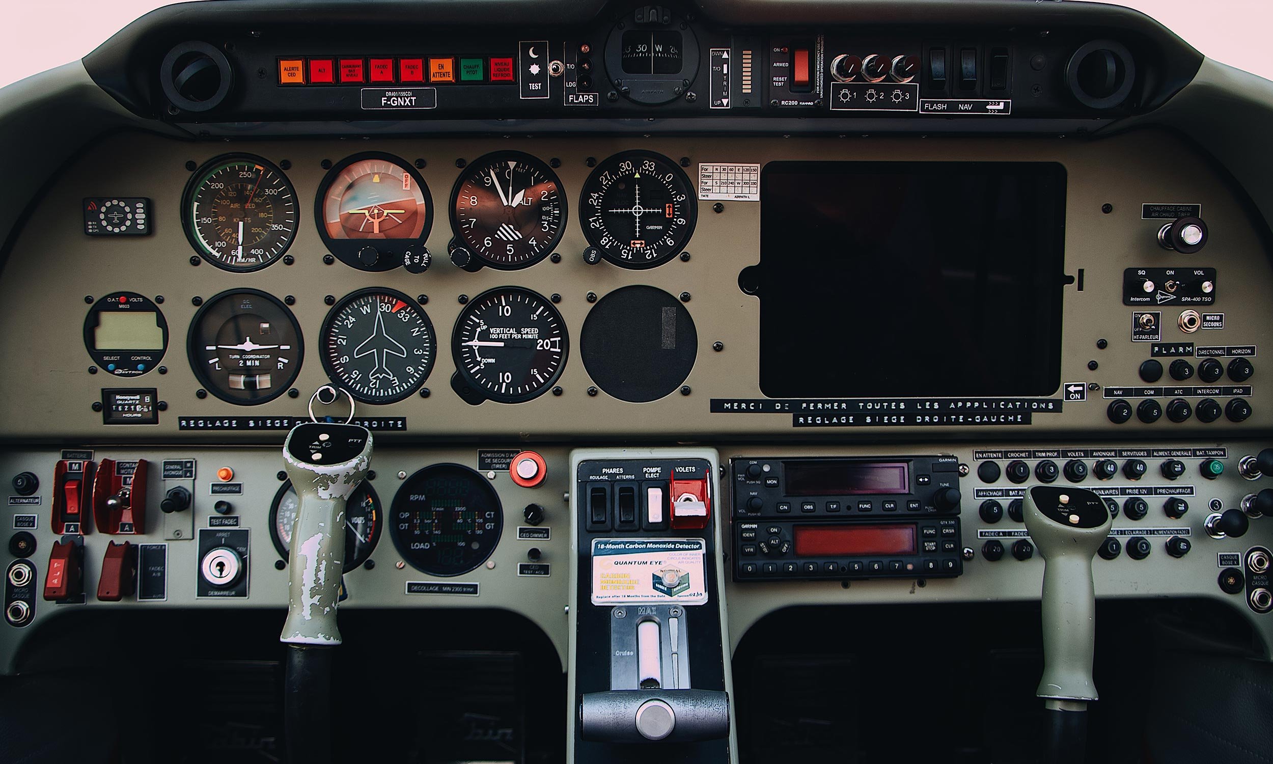 Close-up of control panel in airplane cockpit.