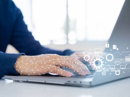 Close-up of hands on a laptop computer overlaid with a hologram of a flow chart and constellation.